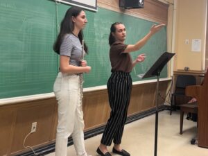 brenna pointing while teaching mary