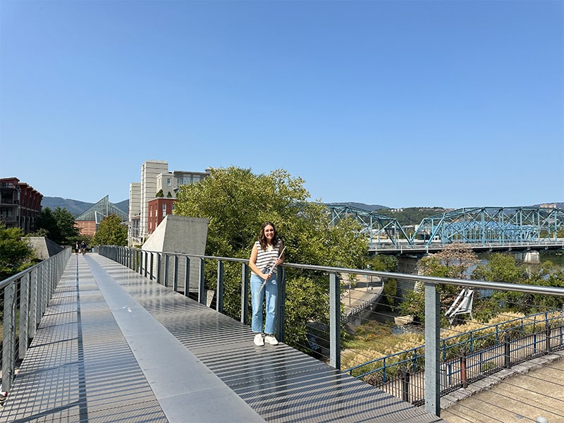 brenna standing on holmberg bridge in chattanooga